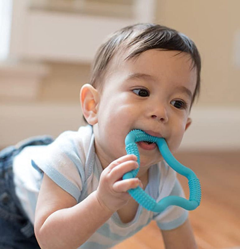 Baby sucking on Dr. Brown&